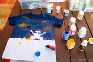 Wall-E t-shirt after having sprayed with bleach, and as the painting of the galaxy clouds begins
