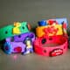 homemade craft foam bracelets in several colors with Crocs charms (Jibbitz) on them