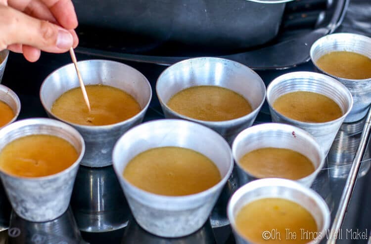 Checking the flan with a toothpick