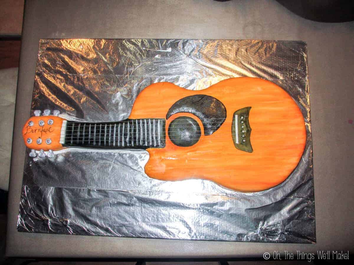 Overhead view of the finished guitar cake made out of fondant