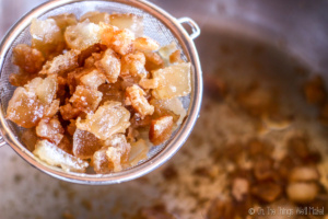 cracklings being strained out of the lard