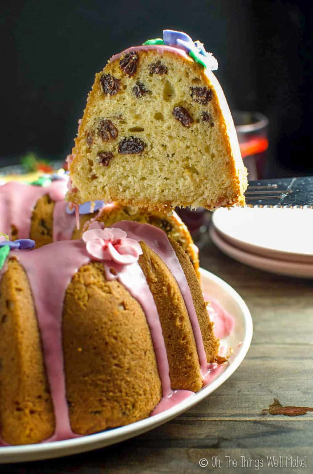 Side view of a slice of a Breudher Cake displays the brandy-soaked raisins inside.