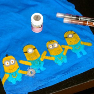 Minion stamped paint on blue fabric