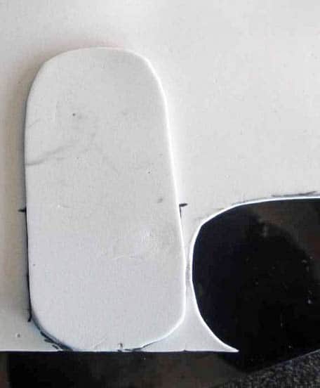 Closeup of an oval cut from craft foam. 