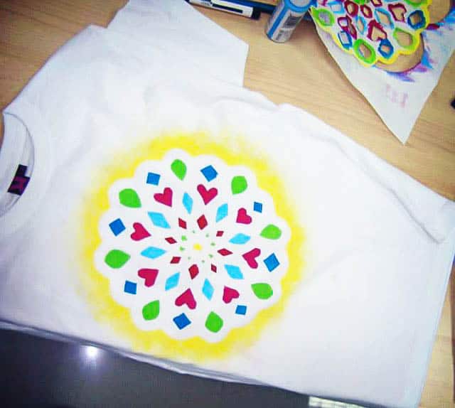 A t-shirt with a hand-painted mandala design