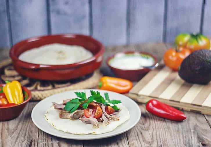 Crispy on the outside, yet moist and flavorful, these slow cooker pork carnitas are so easy to make that you'll have plenty of time leftover for making some homemade corn tortillas. They are also excellent served with my paleo flaxseed tortillas.