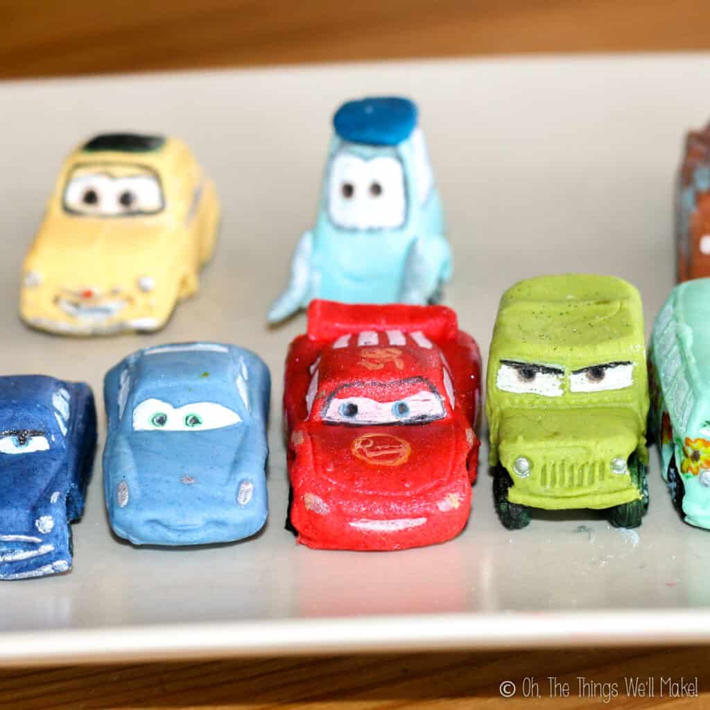 A plate of colorful fondant cars from the movie Cars.