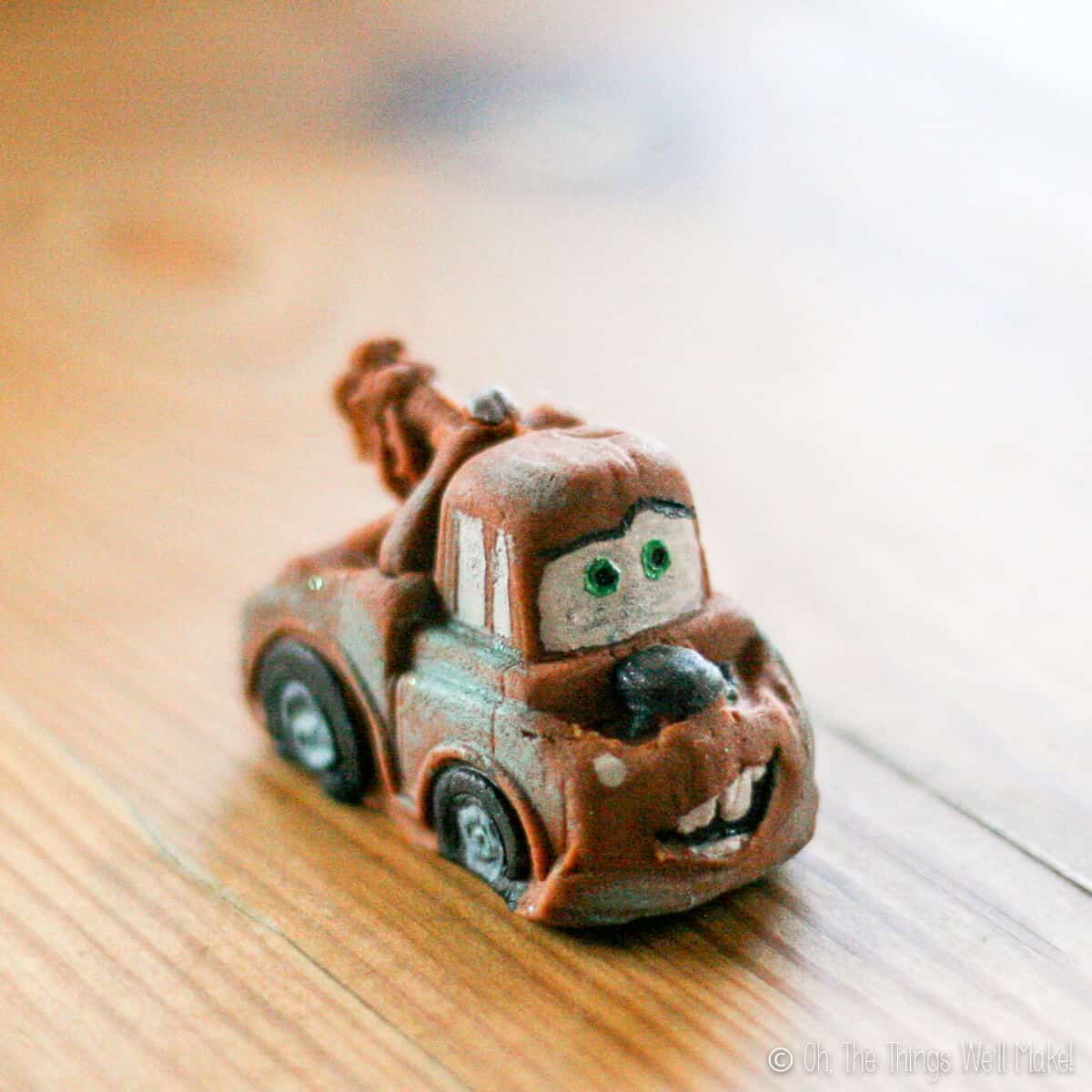 Close up of a brown Matyr (tow truck in Cars movie) fondant decor.