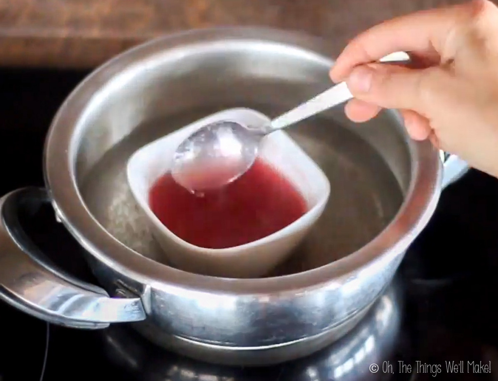 Heating juice and gelatin over a water bath