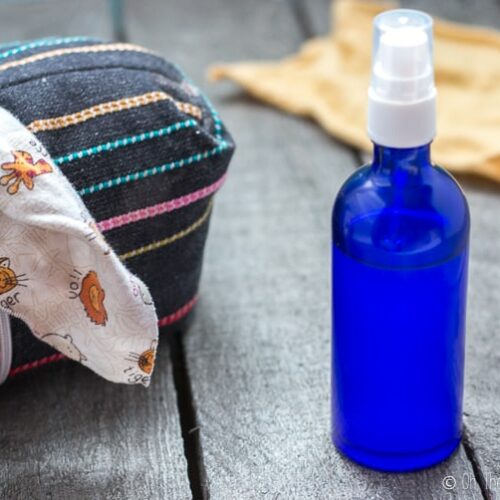 a blue bottle filled with a homemade baby wipe solution