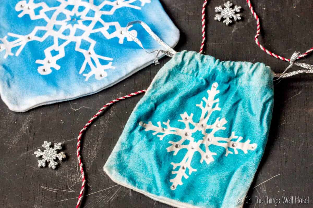 Closeup of two homemade snowflake gift pouches