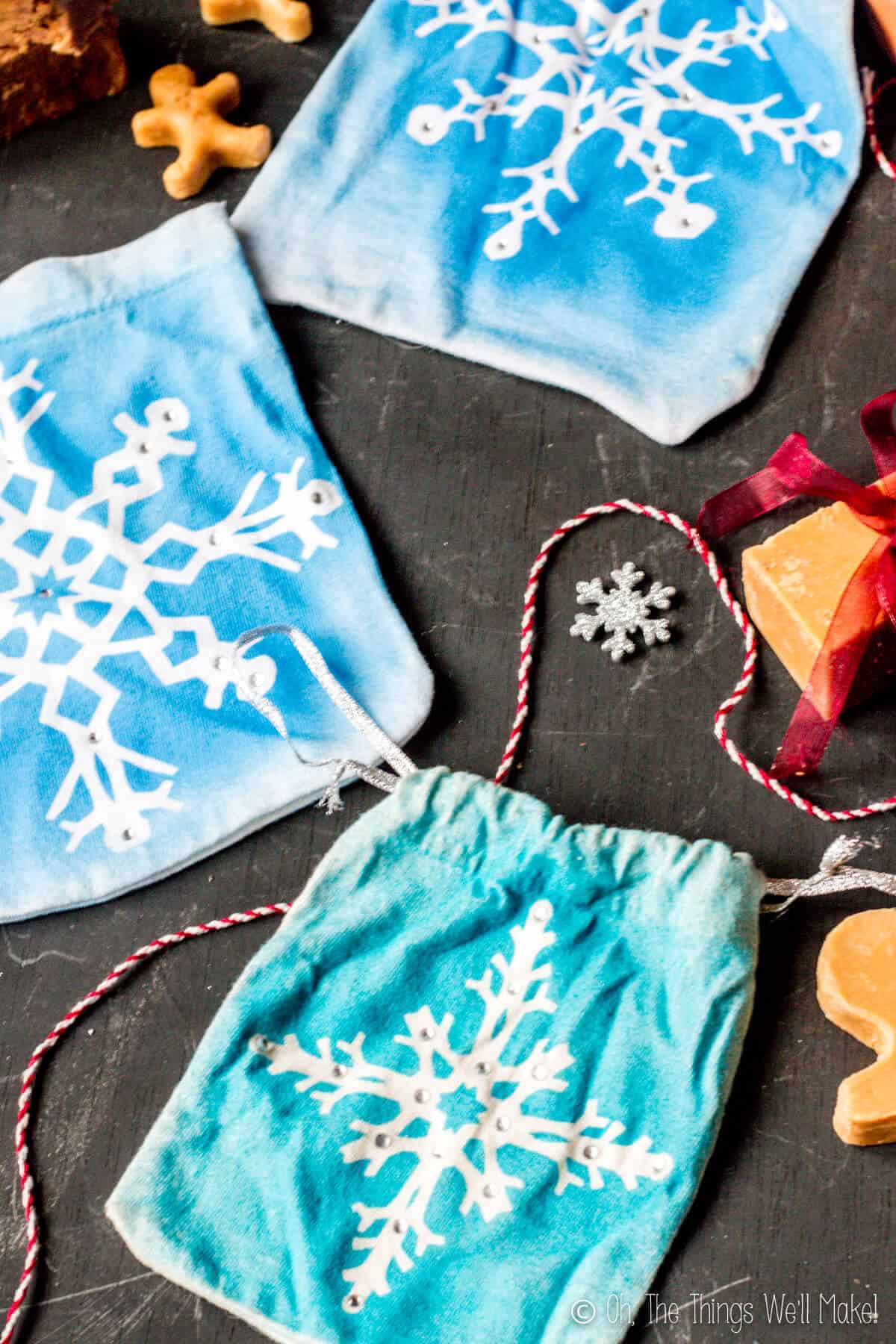 Photo from above of 3 snowflake gift pouches.