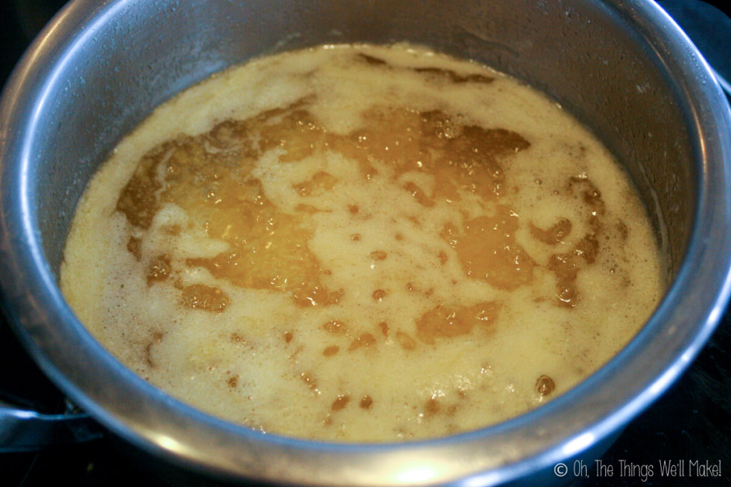 The butter is separating and a foam is starting to form of the surface.