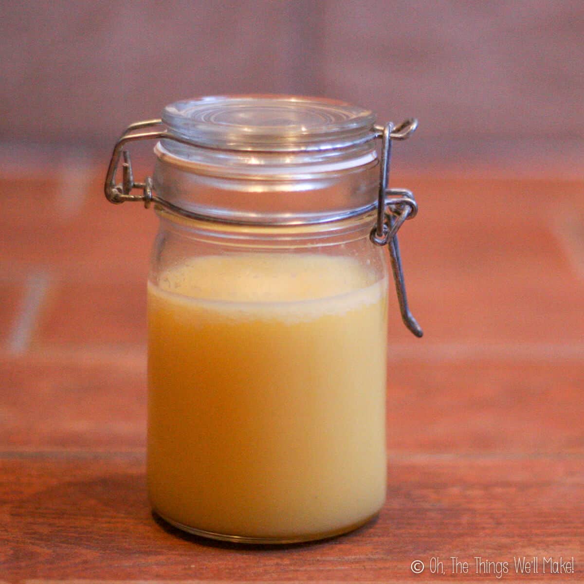 Close up of small jar of homemade ghee.