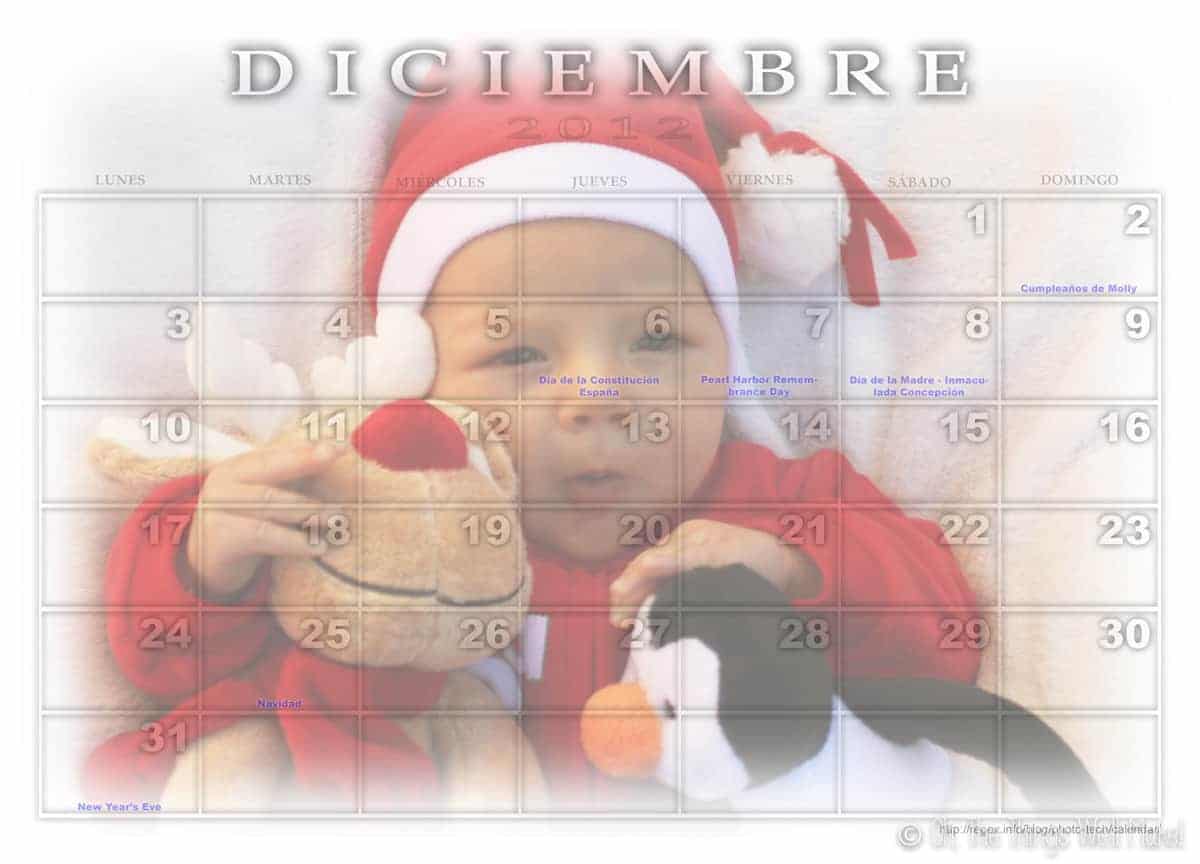 A December calendar with a baby's photo dressed like Santa Claus and with a reindeer and penguin stuffed animals.