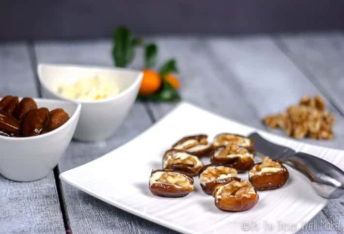 Quick, simple, yet elegant, these cream cheese stuffed dates with walnuts are highly customizable and are the perfect addition to your holiday appetizer lineup.  #dates #appetizers #horsdoeuvres