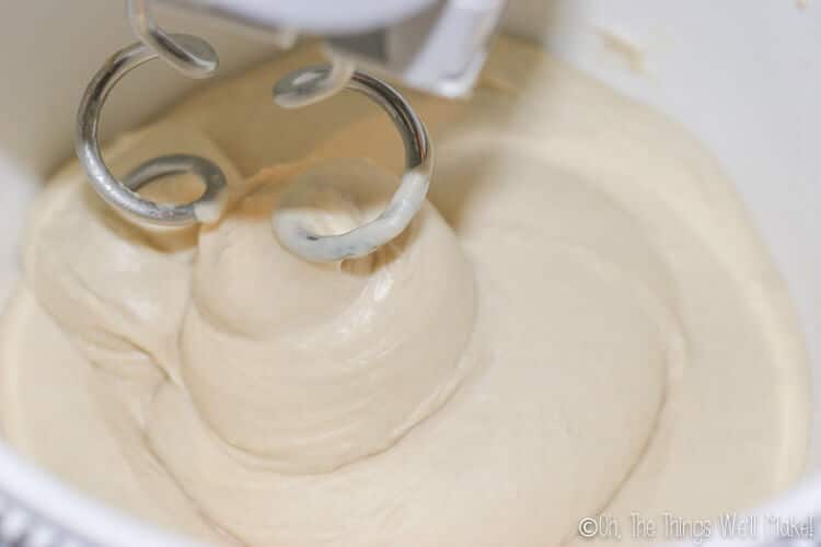 mixing the pizza dough with dough hooks