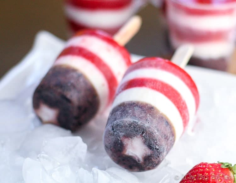 These red, white, and blue patriotic popsicles are healthy, easy to make, and perfect for celebrating the fourth of July or for serving any time you want to show off your patriotism. Plus, they're made with real food and they're refined sugar-free! #thethingswellmake #recipes #redwhiteandblue #patrioticdessert #patrioticdesserts #fourthofjuly #independenceday #starsandstripes #festivefood #healthysnacks #popsicles #sugarfree #frozendessert #patrioticfood #redwhiteandbluefood #strawberries #blueberries #memorialday #july4