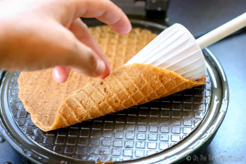 Wrapping the thin waffle around a cone former.