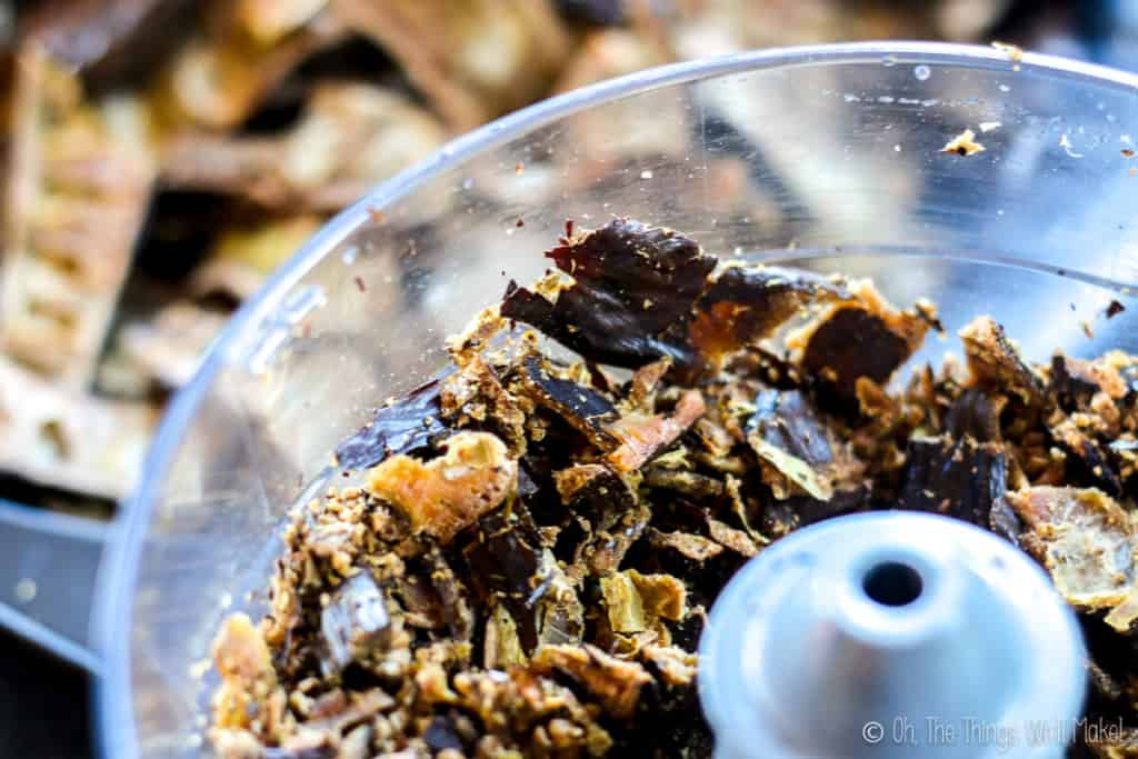 Carob pods being ground up in a food processor.