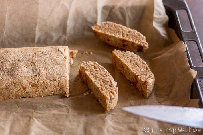 Slicing the baked biscotti to get them ready for their second baking