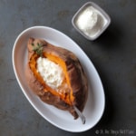 Overhead view of homemade kefir sour cream in a baked sweet potato