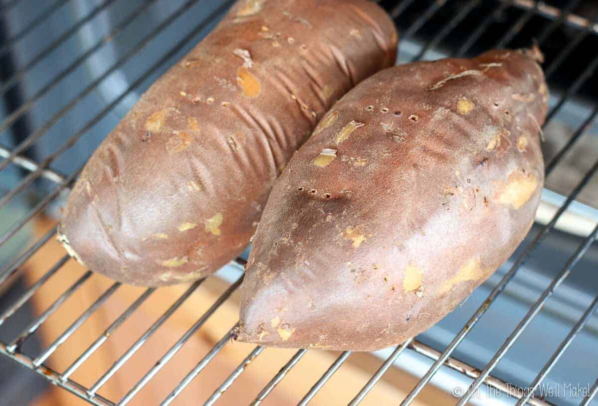 baking sweet potatoes on the grill of an oven