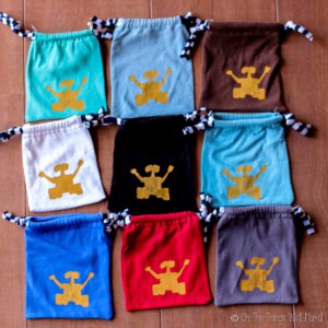 Overhead view of 9 cloth pouches with Wall-E silk screened on them