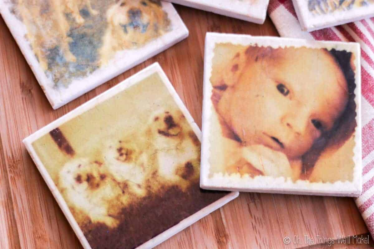 Overhead view of 3 homemade marble photo coasters.