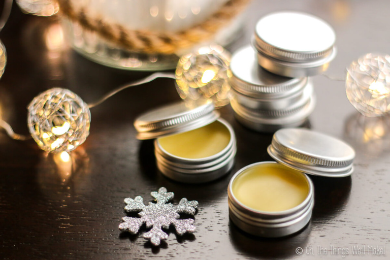 Several tins of solid perfume with lights
