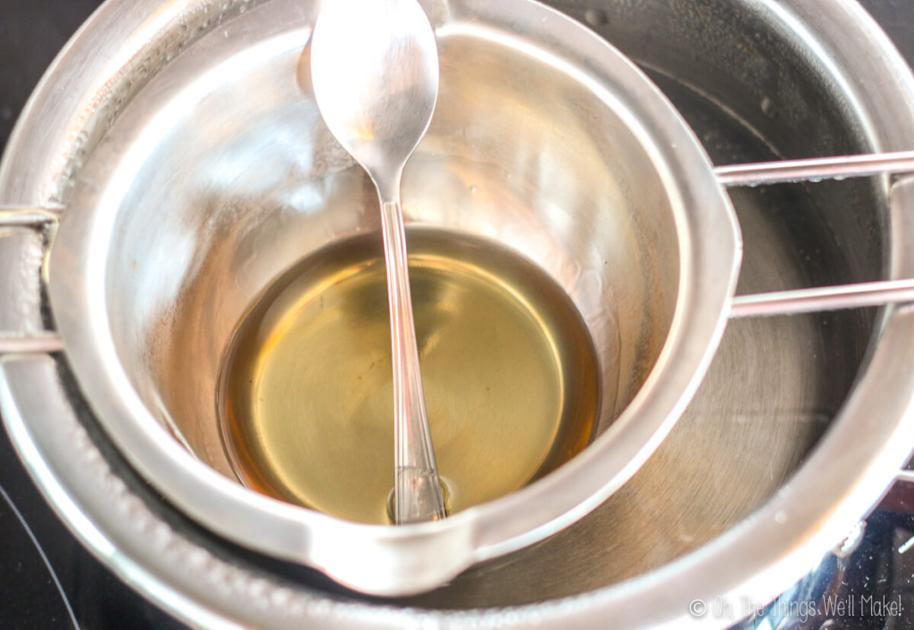 Melted ingredients for a solid perfume in a double boiler