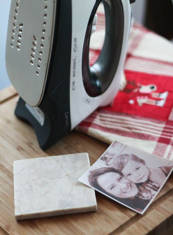 An iron, a marble tile, and a picture on a t-shirt transfer