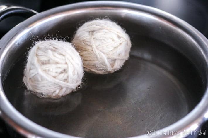 Two balls of wool in a pan full of water