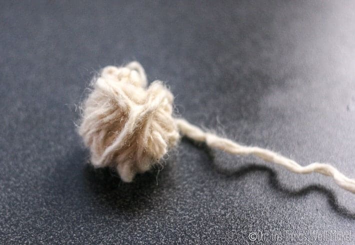 more yarn has been added, forming a small wool ball