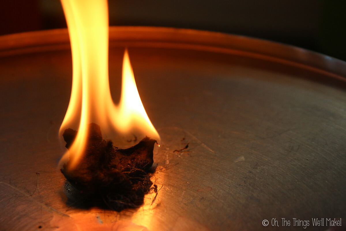 A flaming dryer lint fire starter