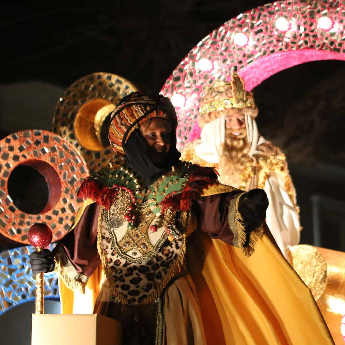 Melchor, one of the three wise men, on a float in a 3 King's Day procession in Spain