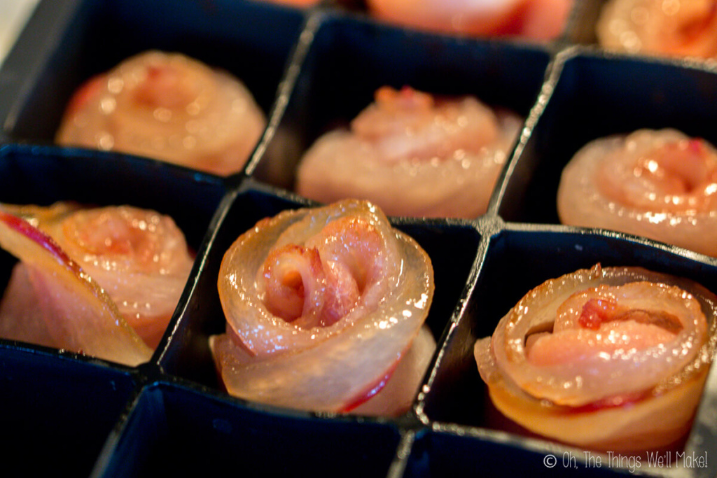 As the bacon roses cook, the edges brown and the layers separate into what looks more and more like a rose.