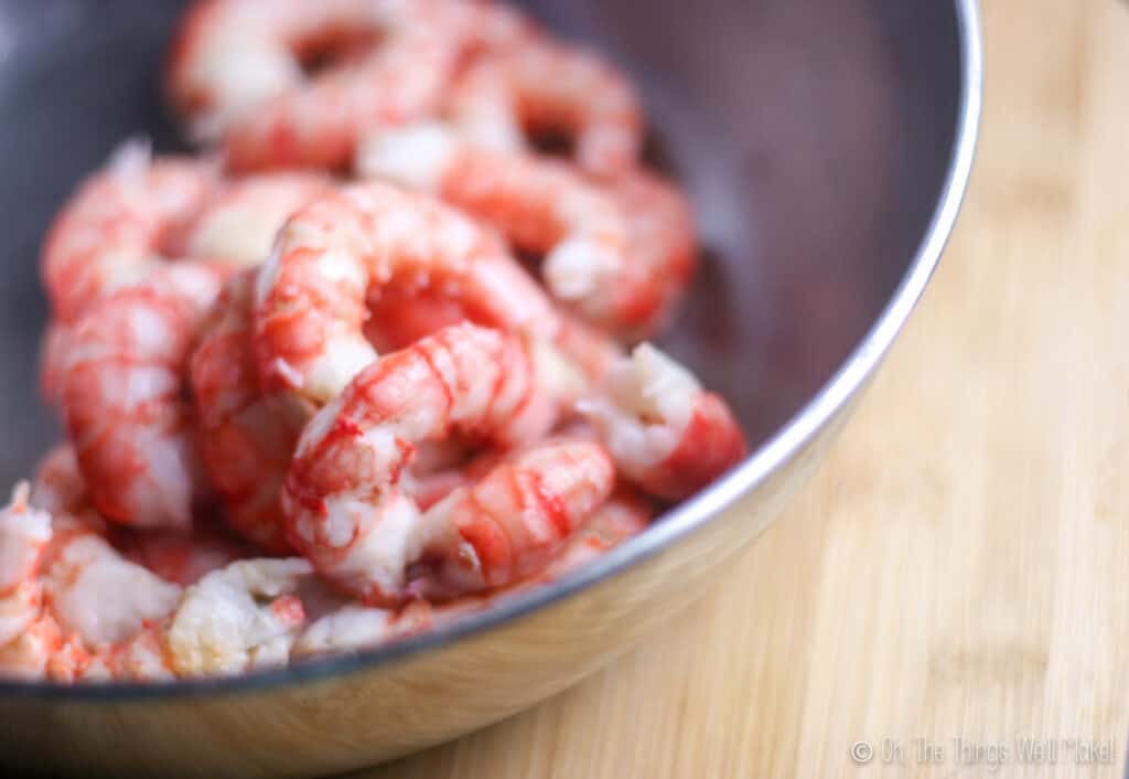 a closeup of some peeled Denia red prawns in a bowl