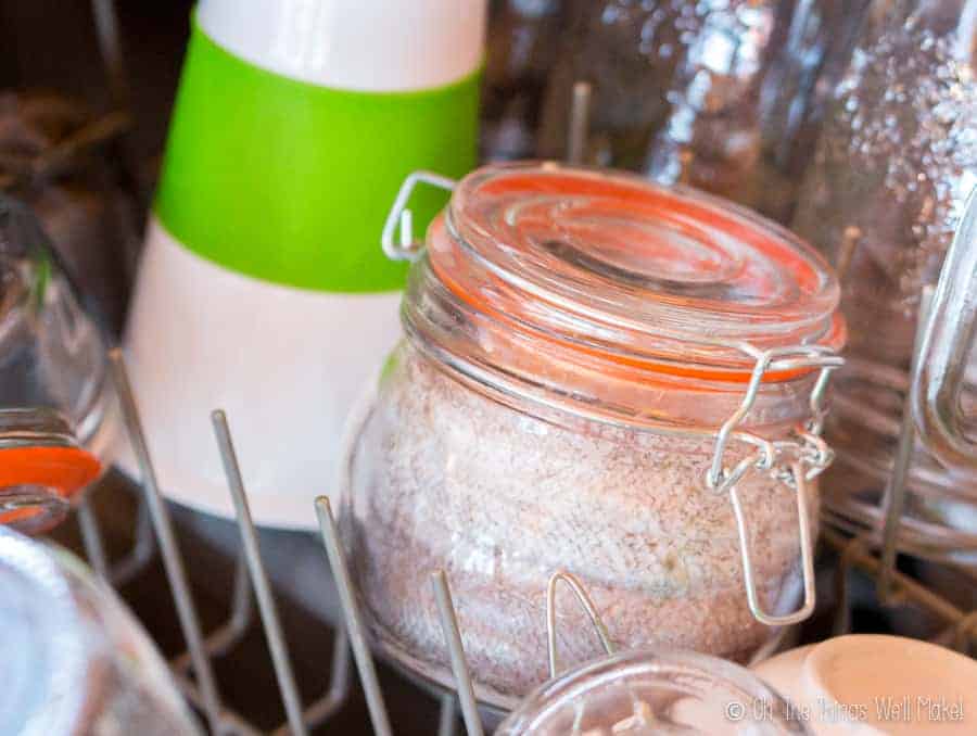 A jar in the dishwasher filled with hake, ready for cooking it in the dishwasher.