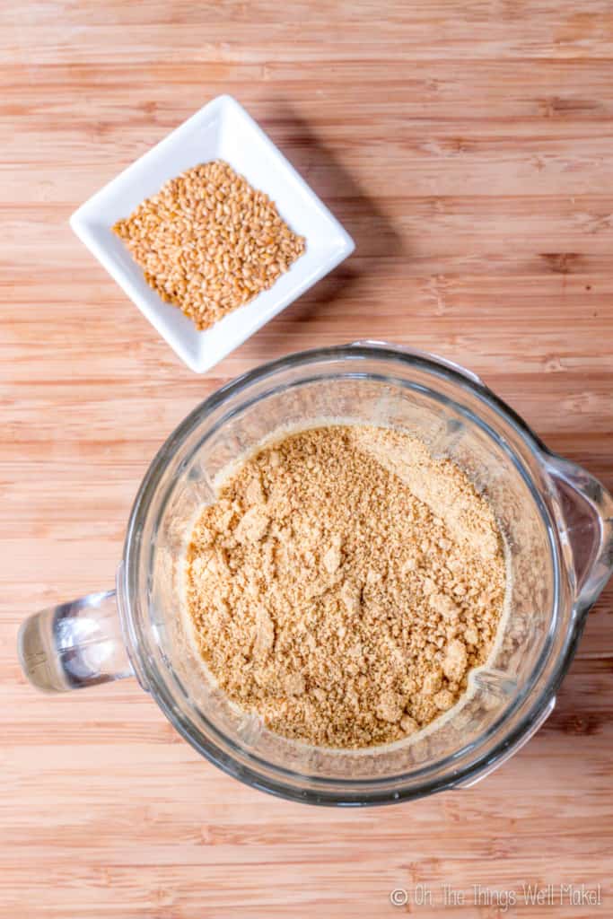 Overhead view of whole flax seeds and ground flaxseeds