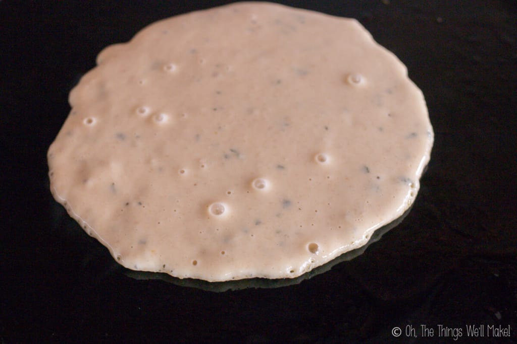 bubbles starting to form in the cooking pita