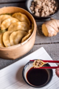 This paleo dim sum recipe uses a paleo pasta filled with flavorful ginger and pork and is steamed to perfection to make these amazing Asian potstickers.