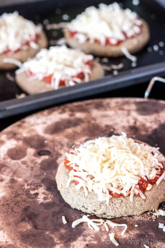 This paleo pizza crust recipe is quick and easy and absolutely delicious. Even my picky husband and toddler love it when I make pizza with it.