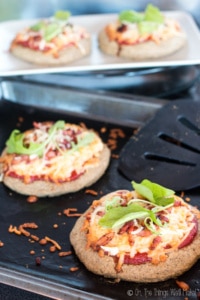 This paleo pizza crust recipe is quick and easy and absolutely delicious. Even my picky husband and toddler love it when I make pizza with it.