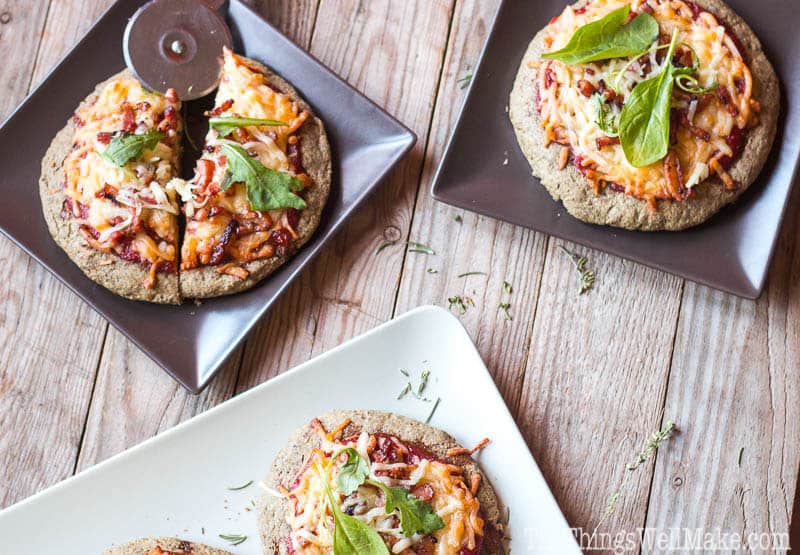 This paleo pizza crust recipe is quick and easy and absolutely delicious. Even my picky husband and toddler love it when I make pizza with it.