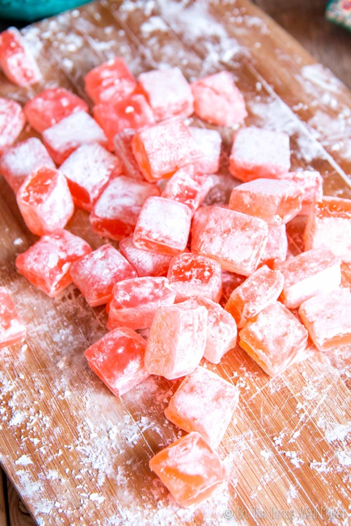 Two types of homemade Turkish delight on a cutting board.