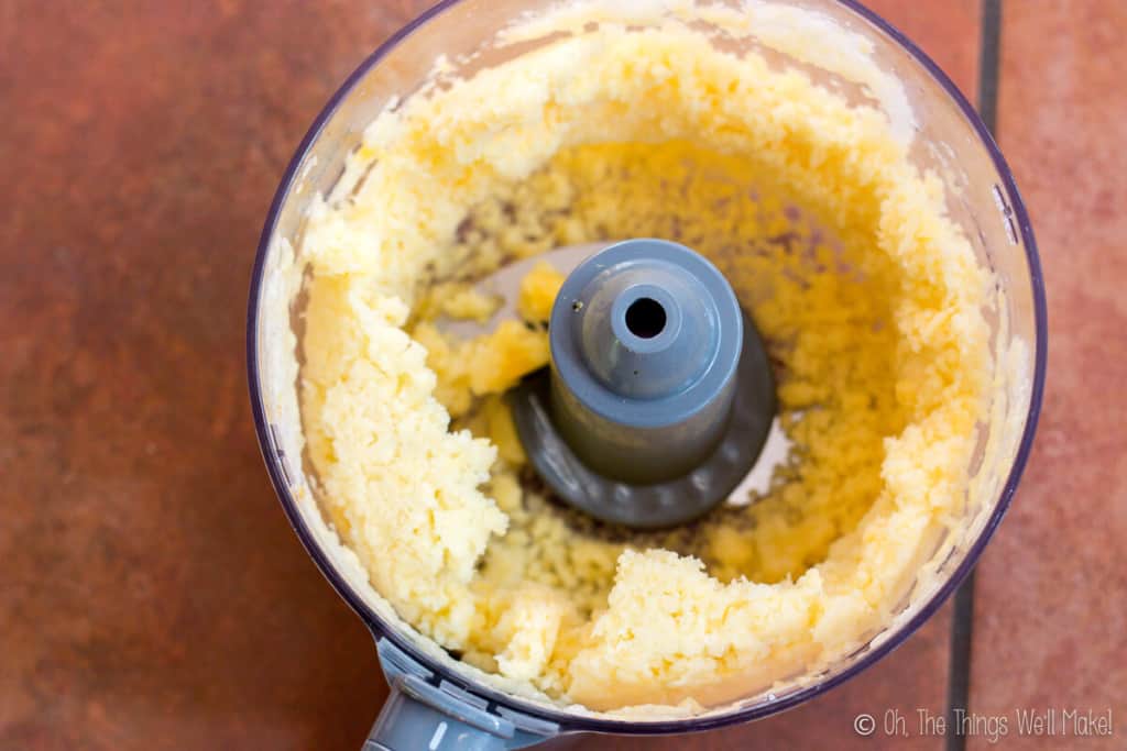 food processor with processed frozen pineapple inside