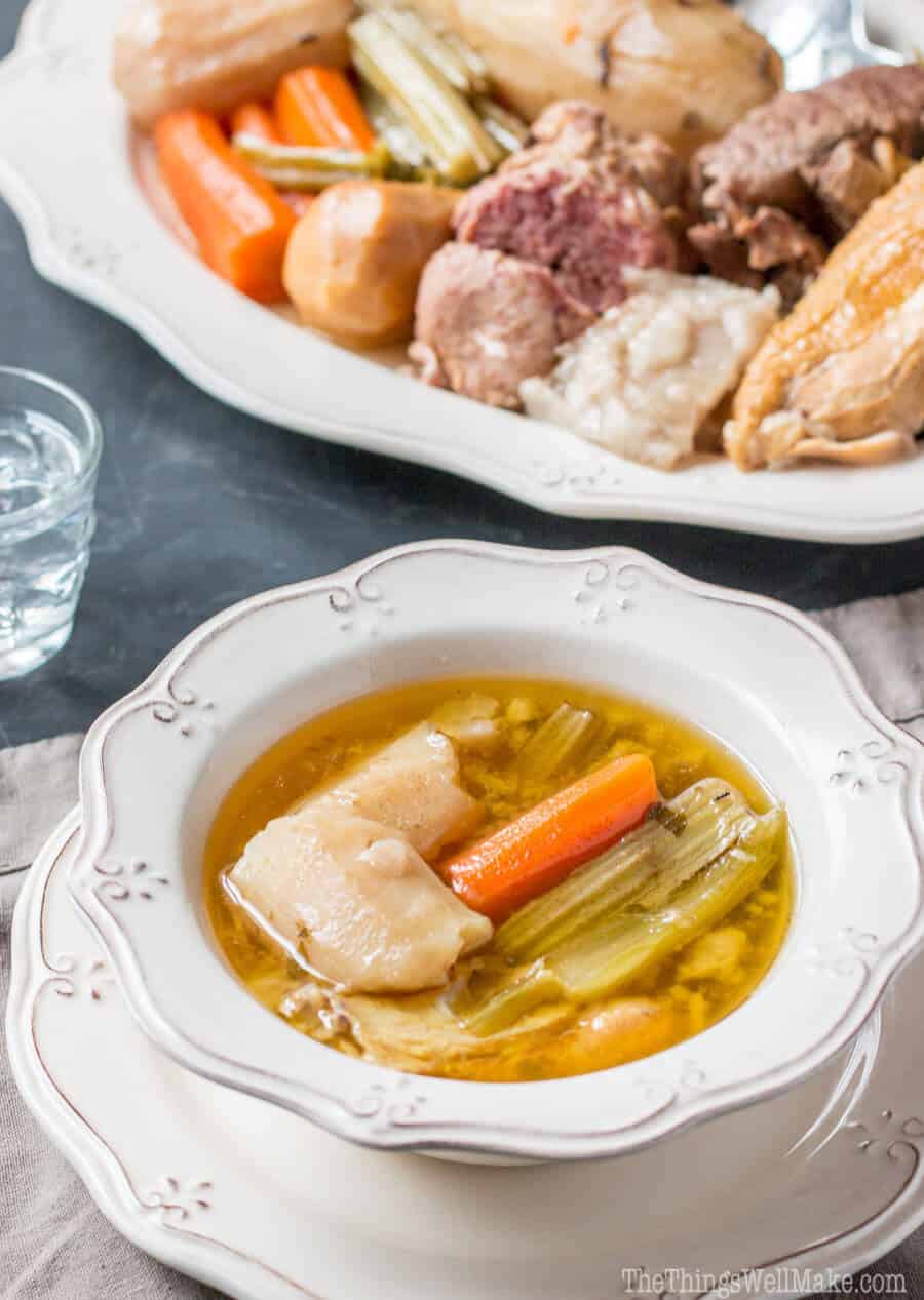 Closeup of a bowl of broth and veggies for Valencian puchero.