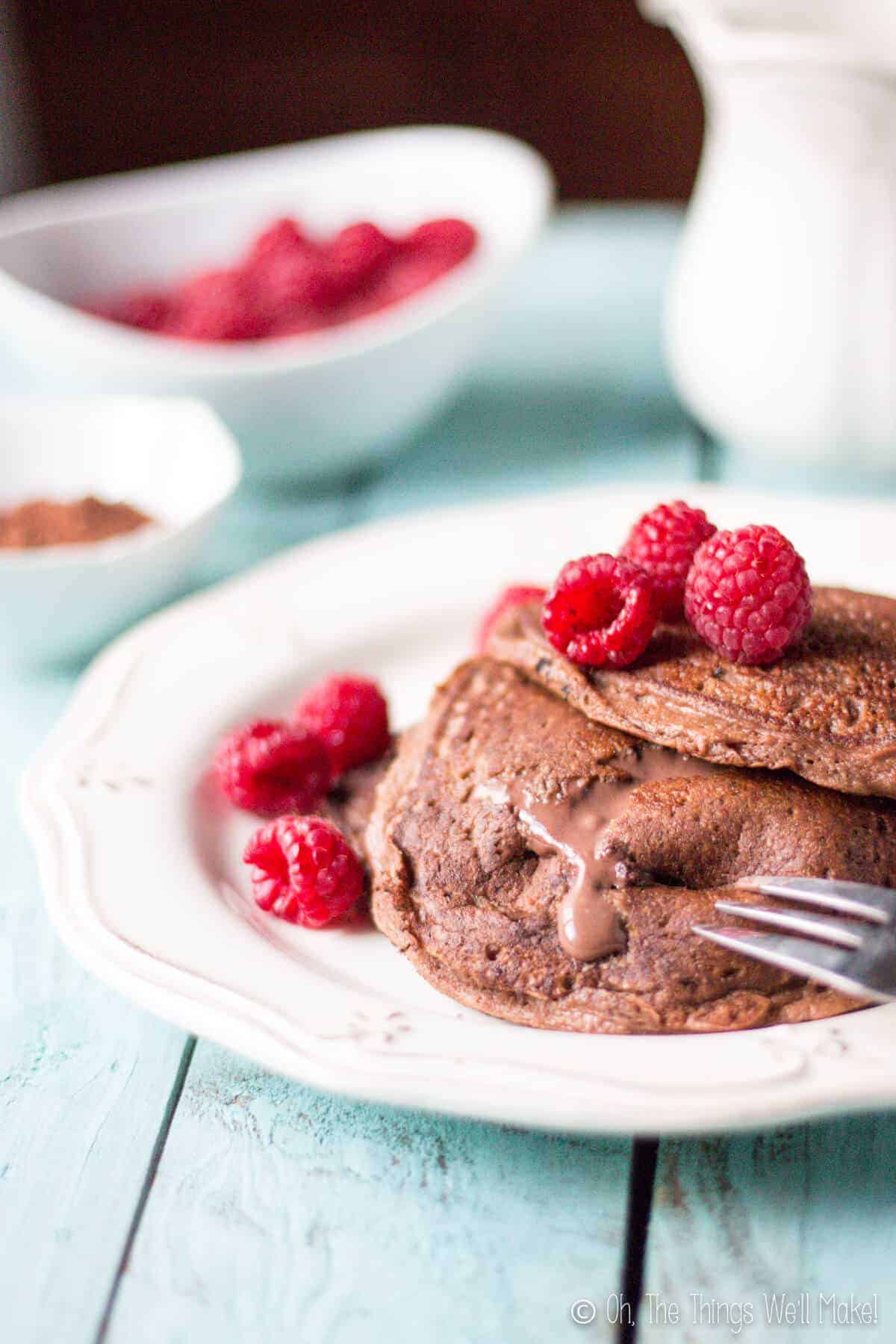 grain free stuffed double chocolate pancakes with mascarpone filling oozing out of them.