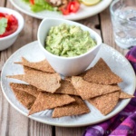 Easily make these crispy, flaxseed vegan and paleo tortilla chips and taco shells in less than 30 minutes, using just three simple ingredients!